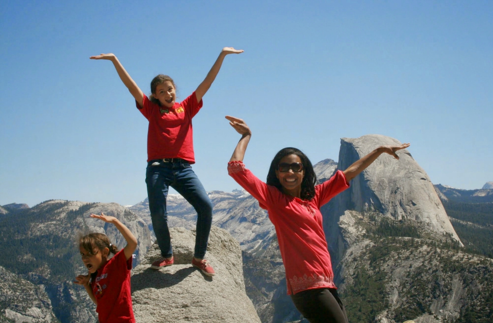Olivia Sally, center, strikes a pose with her sister Madison and mother Dawn at Half Dome in Yosemite National Park. (Provided photo)