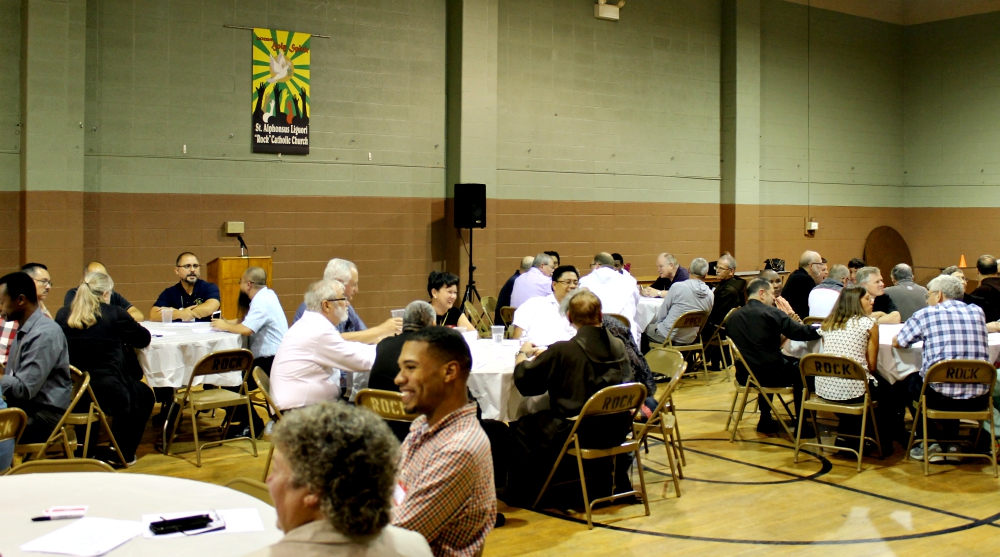 Members of male religious orders meet with community activists at St. Alphonsus Liguori Catholic Church in St. Louis Aug. 1 in a racial justice immersion event, part of the annual assembly of the Conference of Major Superiors of Men. (NCR/Brian Roewe)