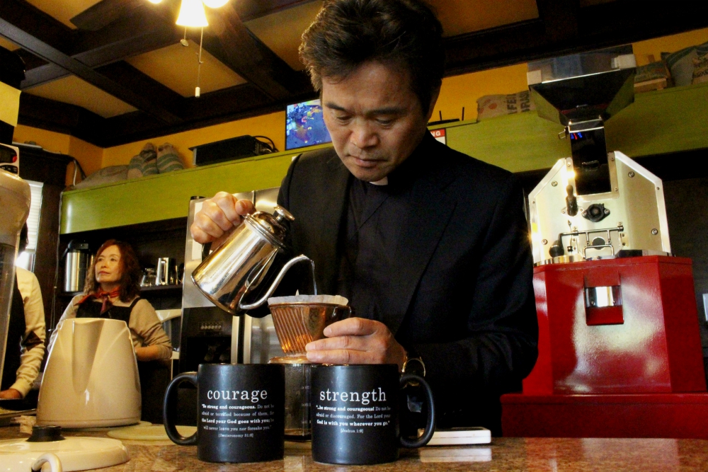 Jesuit Fr. Robert Choi, known as the "Coffee Priest," is meticulous about his coffee. He teaches a class all about coffee, including about where his beans come from and how to make the best coffee. (Heather Adams)