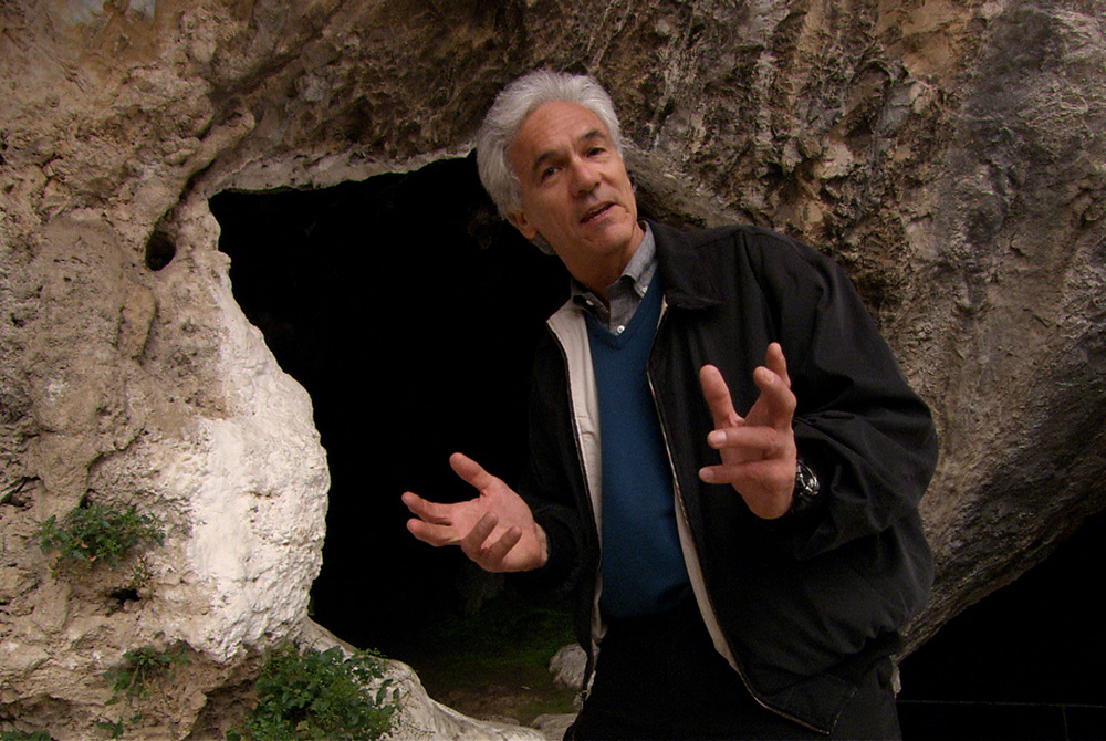 Brian Swimme stands outside the cave of Pythagoras on the island of Samos during "Journey of the Universe." (Courtesy of Journey of the Universe) Brian Swimme stands outside the cave of Pythagoras on the island of Samos during "Journey of the Universe." (Courtesy of Journey of the Universe)