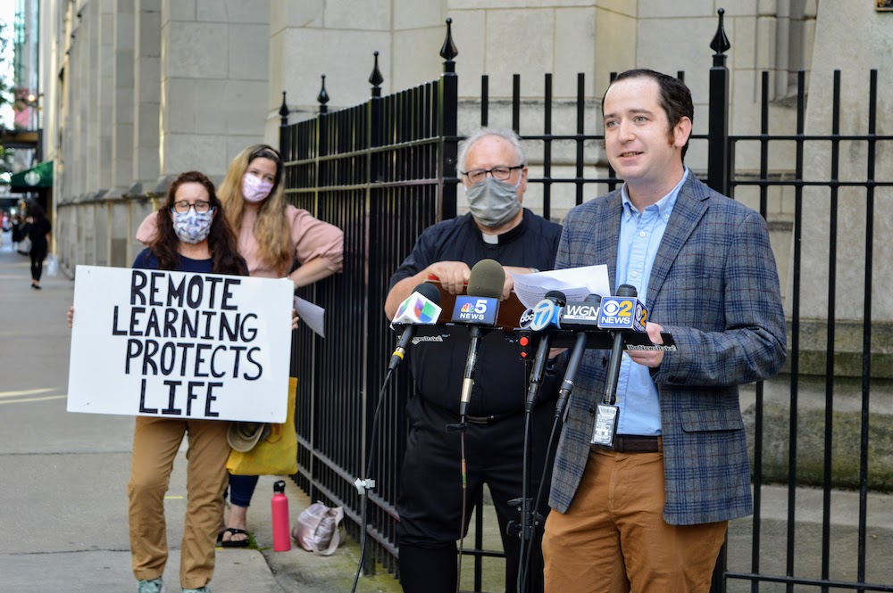 James Cahill, 32, a middle school social studies teacher at St. Francis Xavier School in Wilmette, Illinois, speaks out against the Chicago Archdiocese's reopening plan at a rally in front of schools' headquarters in downtown Chicago on Aug. 20. (Courtesy
