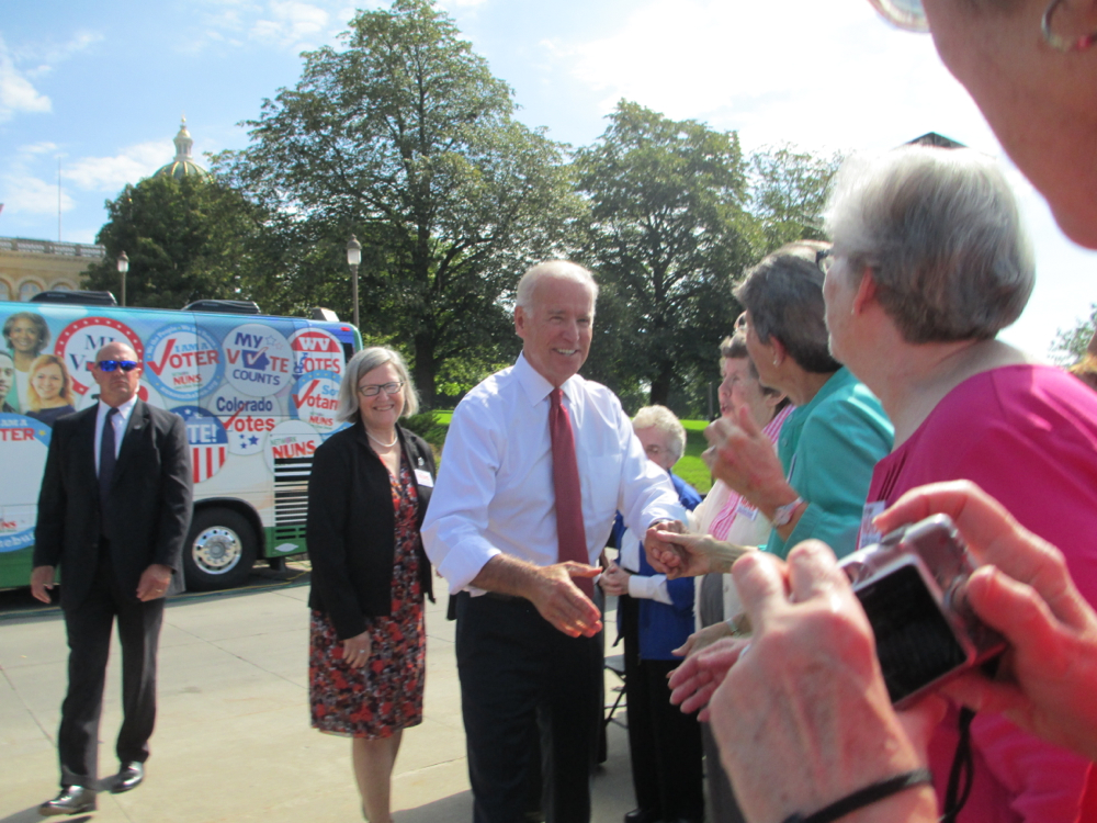 Vice President Joe Biden greets Catholic sisters who were kicking off Network's Nuns on the Bus tour Sept. 17, 2014, in Des Moines, Iowa. Social Service Sr. Simone Campbell, executive director of Network Catholic Social Justice Lobby, is at left behind hi Vice President Joe Biden greets Catholic sisters who were kicking off Network's Nuns on the Bus tour Sept. 17, 2014, in Des Moines, Iowa. Social Service Sr. Simone Campbell, executive director of Network Catholic Social Justice Lobby, is at left behind hi
