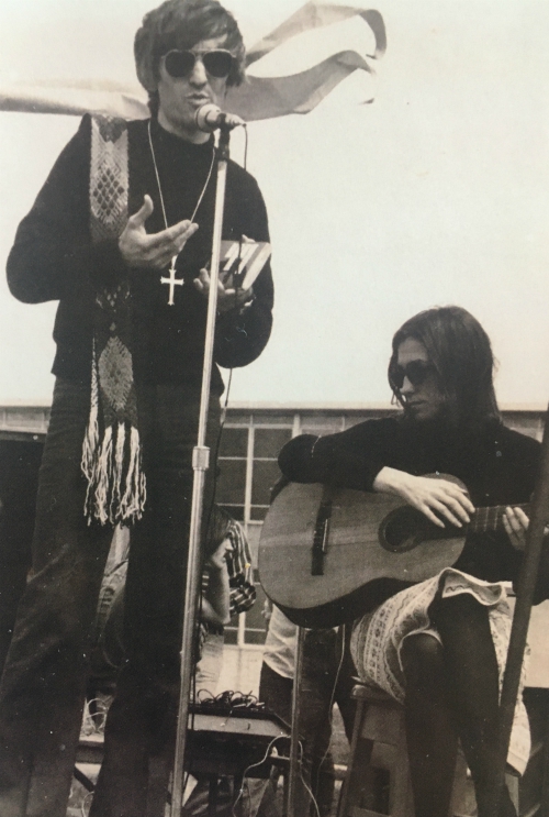 Fr. John Giuliani and Sr. Kathleen Deignan appear on stage during an outdoor liturgical service at Sacred Heart University for the first Earth Day on April 22, 1970. (Courtesy of Kathleen Deignan)
