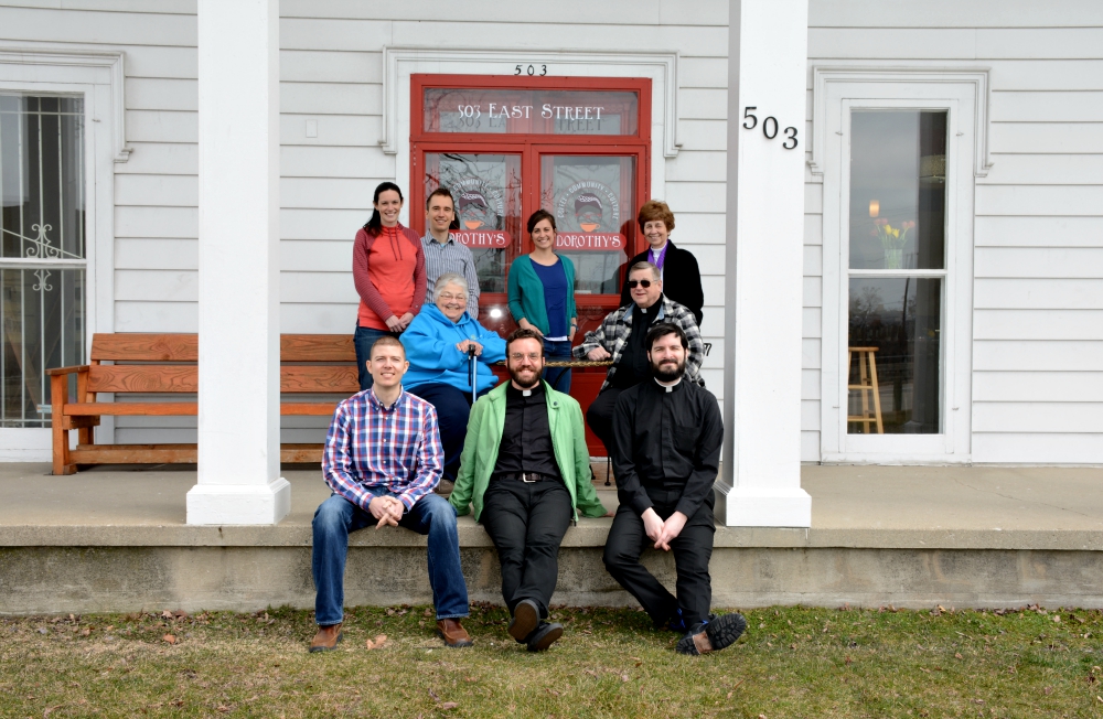 The outreach team of the Catholic Community of Flint in front of Dorothy's House of Coffee in Flint, Michigan (Kim's Photography)