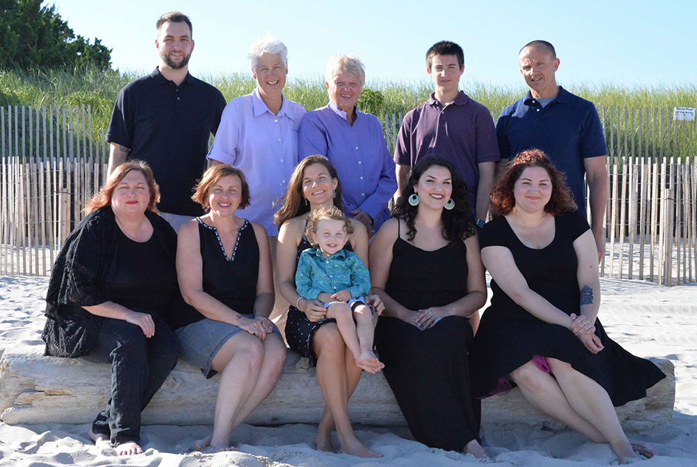 Kane Maddock family photo Honour Maddock and Kathleen Kane, standing second and third from the left, are pictured in a 2016 family photo with Kathleen's two daughters and son, their daughter-in-law and son-in-law, and their two granddaughters and two grandsons. (Courtesy photo)