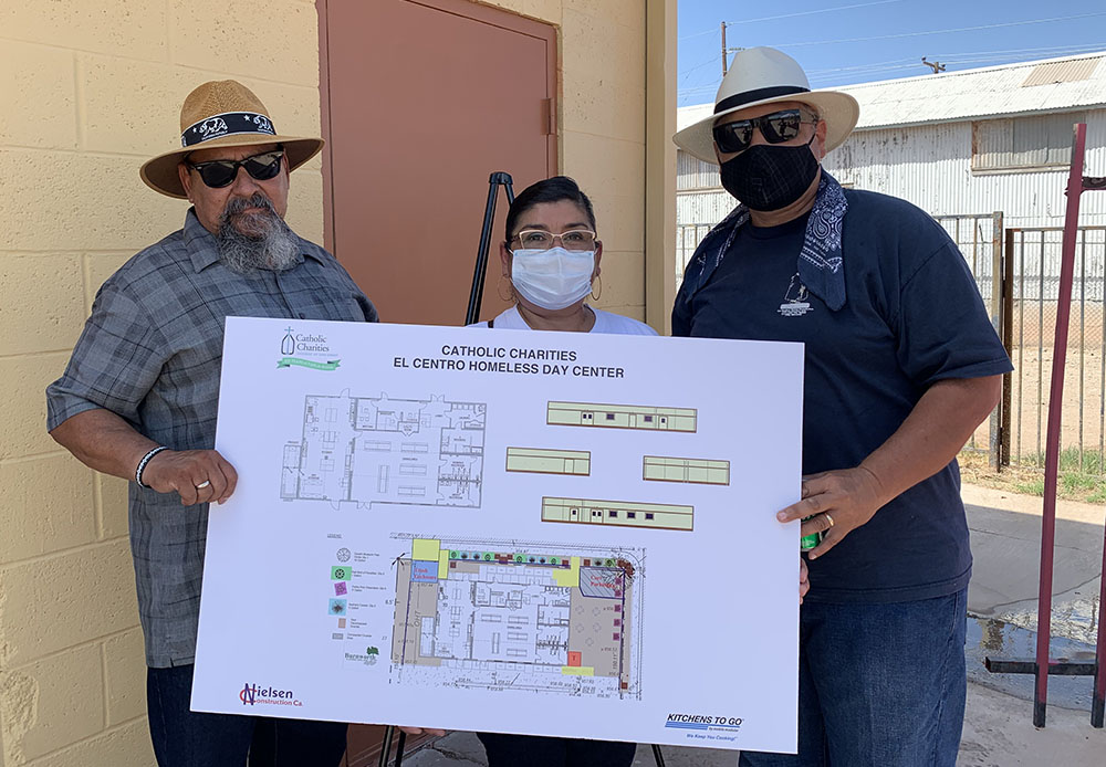 From left, Andy Diaz, Monica Enriquez and Richard Enriquez show the floor plan for the El Centro Homeless Day Center in Imperial County in Southern California. (NCR photo/Melissa Cedillo)