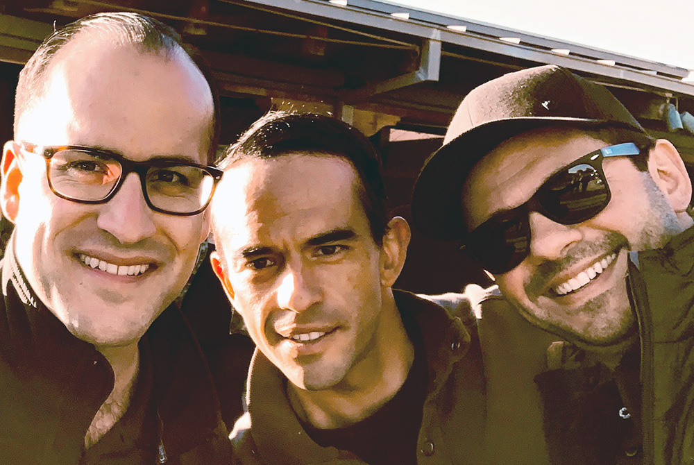 From left: executive producer Robert L. Hymers III, actor Guillermo Iván and director and co-writer Pedro Brenner appear in a production still from the film. (Courtesy of Vision Films, Inc.)