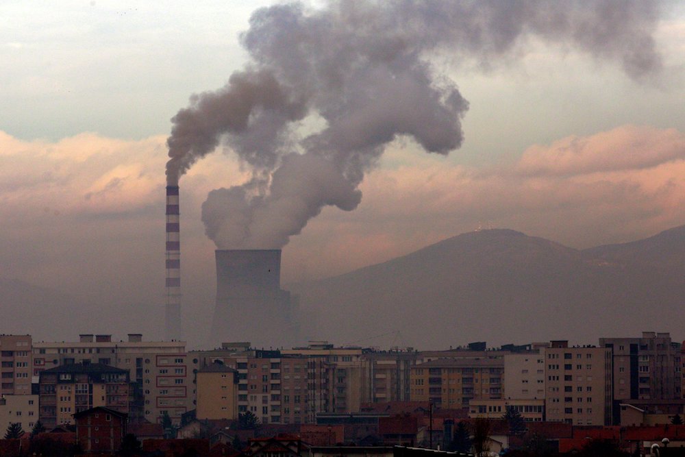 Smoke and steam rise from a coal-fired power plant in Obilic, Kosovo, in 2019. (CNS photo/Ognen Teofilovski, Reuters)