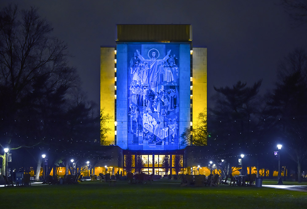 The University of Notre Dame's Hesburgh Library Word of Life mural is lit in the colors of the Ukrainian flag in solidarity with the people of Ukraine on March 18. (University of Notre Dame/Matt Cashore)