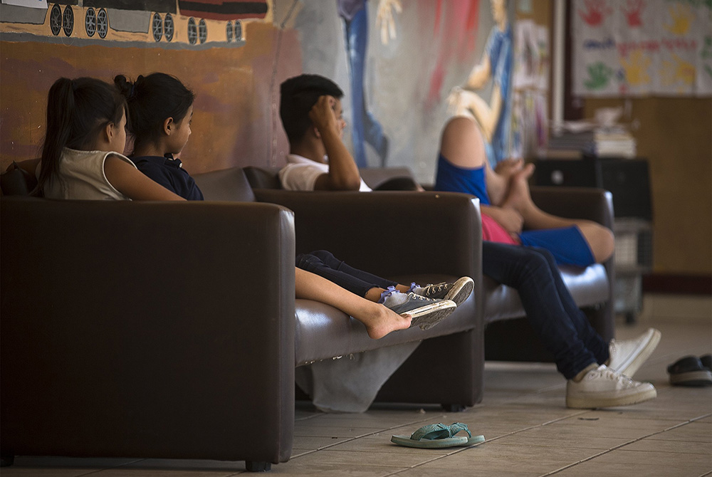 Children watch television at the Casa del Migrante shelter Sept. 24, 2019, in Ciudad Juarez, Mexico. (CNS/Tyler Orsburn)