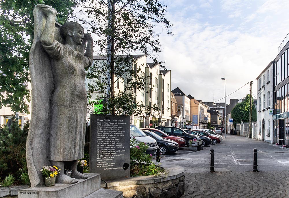 Near a former Magdalene laundry in Galway, Ireland, a memorial with a sculpture by Mike Wilkins and a plaque with a poem by Patricia Burke Brogan honors the women who were held such institutions. (Flickr/William Murphy)