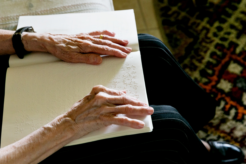 Cuban-American Adelina Maideski reads Braille Catholic materials in early May at her residence in Coconut Creek, Florida. (CNS/Tom Tracy) Cuban-American Adelina Maideski reads Braille Catholic materials in early May at her residence in Coconut Creek, Florida. (CNS/Tom Tracy)
