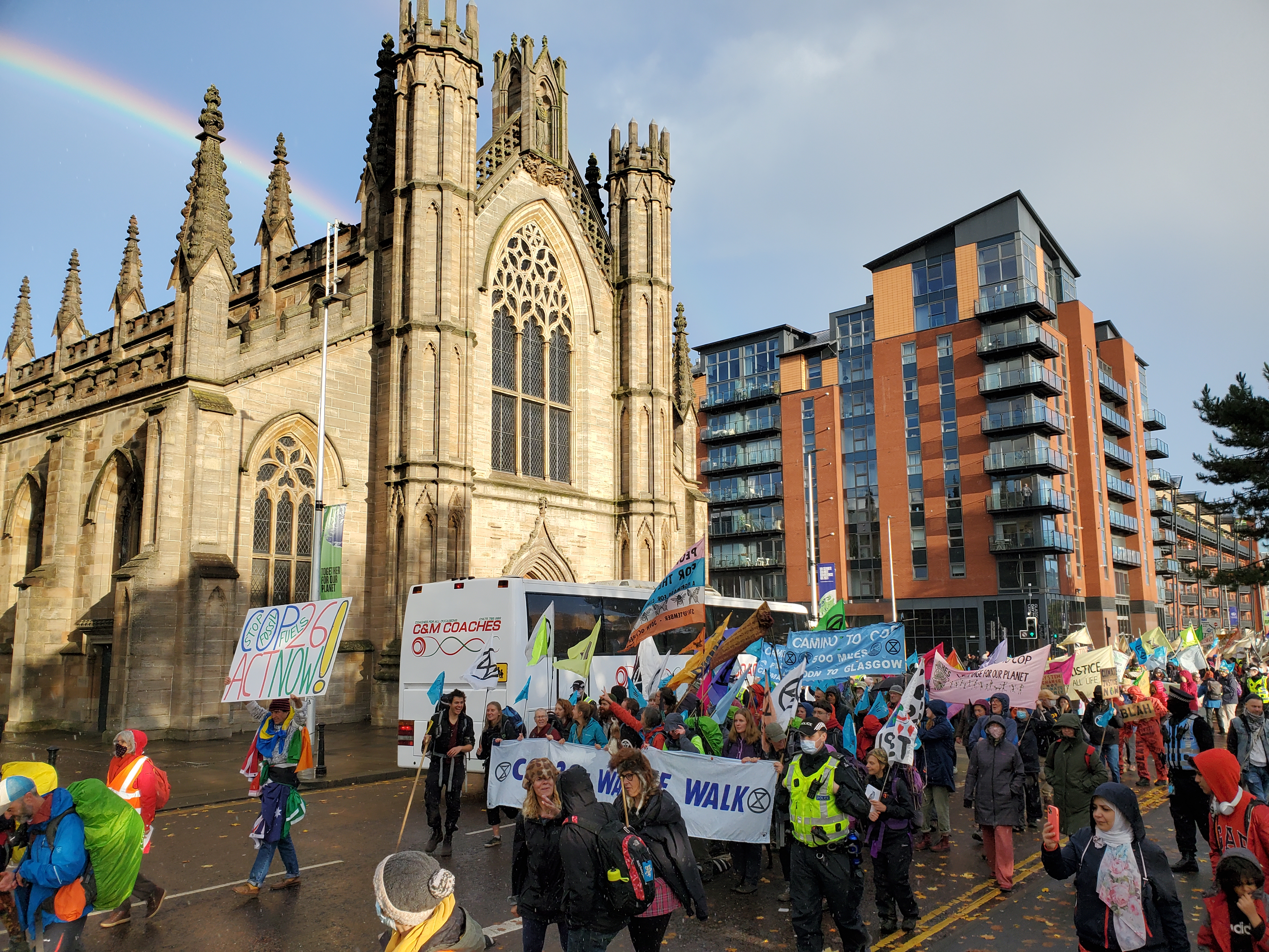 Climate pilgrims arriving in Glasgow, Scotland, Oct. 30 for the U.N. climate conference pass St. Andrew's Cathedral near the River Clyde. (NCR/Brian Roewe)