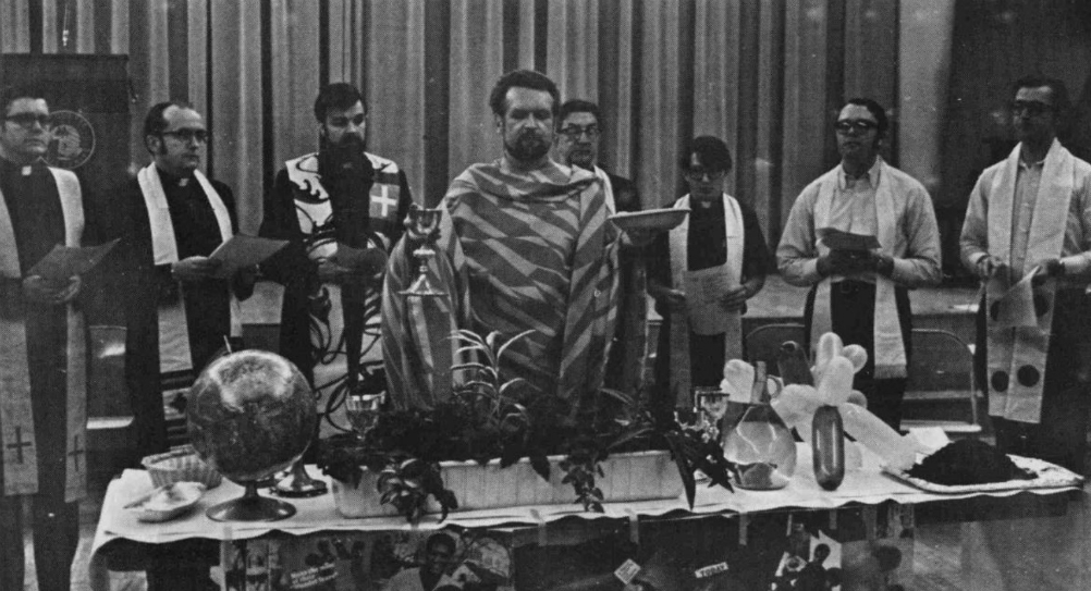 Jesuit Fr. Quentin Quesnell, center, leads the Mass for the Earth at Marquette University on the first Earth Day. Pictured on the far right is Jesuit Fr. Robert Doran. (Special Collections and University Archives, Marquette University Libraries)