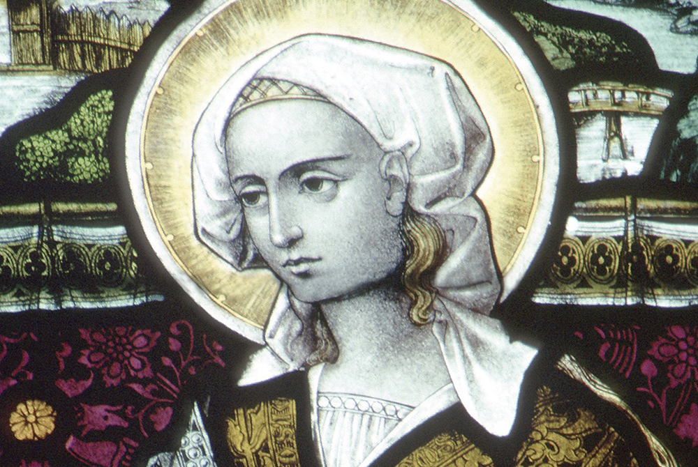 Mary Magdalene is pictured in a stained-glass window in the Church of St. Waudru in Mons, Belgium. (CNS photo)