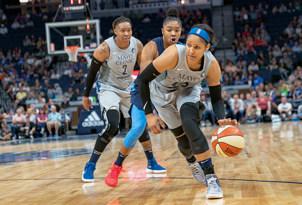 Maya Moore of the Minnesota Lynx dribbles around Alex Bentley of the Atlanta Dream during a WNBA game on Aug. 5, 2018, in Minneapolis. (Wikimedia Commons/Lorie Shaull)