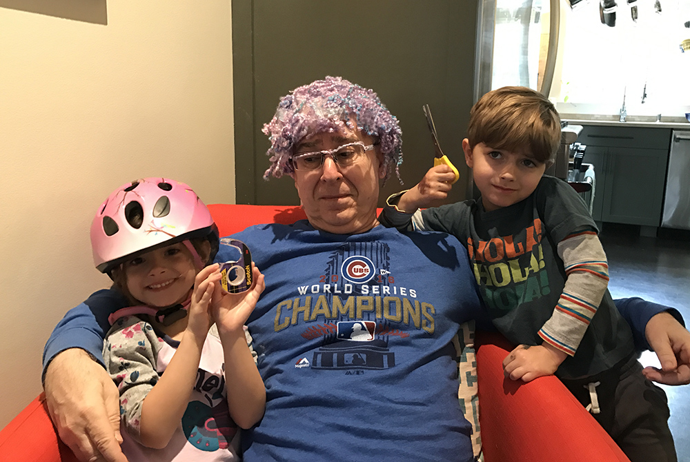 Mike Leach's hairdo from Mae and Jackson Grampa Michael Leach shows off the "hair transplant" created by his twin grandchildren, Mae and Jackson Leach. He wore it all the way back home on the plane from Atlanta to New York. (Courtesy of Jeff Leach)
