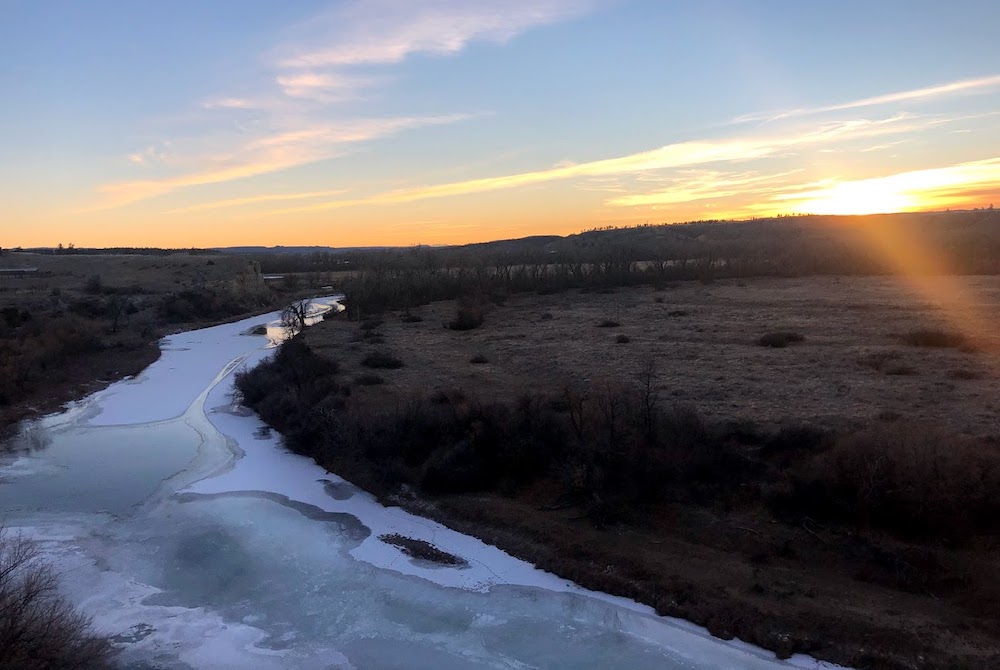 Sunrise over a frozen creek