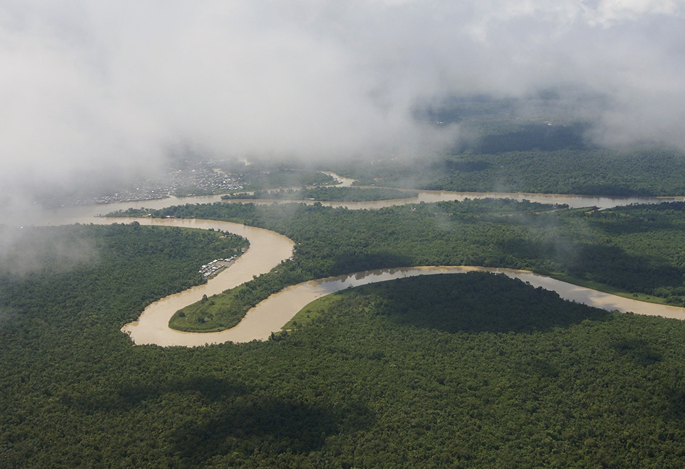 The Rio Quito flows into the Atrato River in this aerial view. In 2017, the Colombian Constitutional Court issued a landmark decision that granted legal rights to the Atrato River. (Courtesy of ABColombia/Steve Cagan)