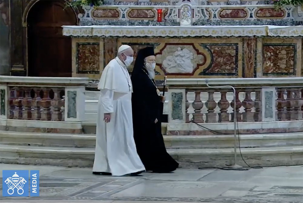 Pope Francis and Ecumenical Patriarch Bartholomew walk together at the end of the service Oct. 20 in Rome. (NCR screenshot/Vatican Media)