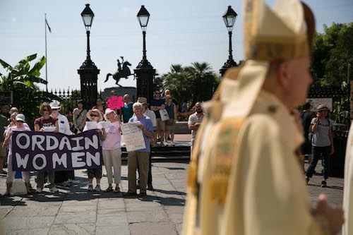 Supporters of women's ordination gather in Jackson Square in New Orleans outside the St. Louis Cathedral during the archdiocese's ordination ceremony for new priests in June 2015. (Gabriela Arp)