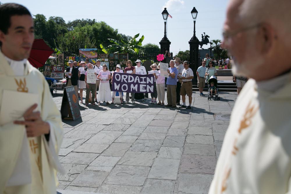 Supporters of women's ordination gather in Jackson Square in New Orleans outside the St. Louis Cathedral during the archdiocese's ordination ceremony for new priests in June 2015. (Gabriela Arp)