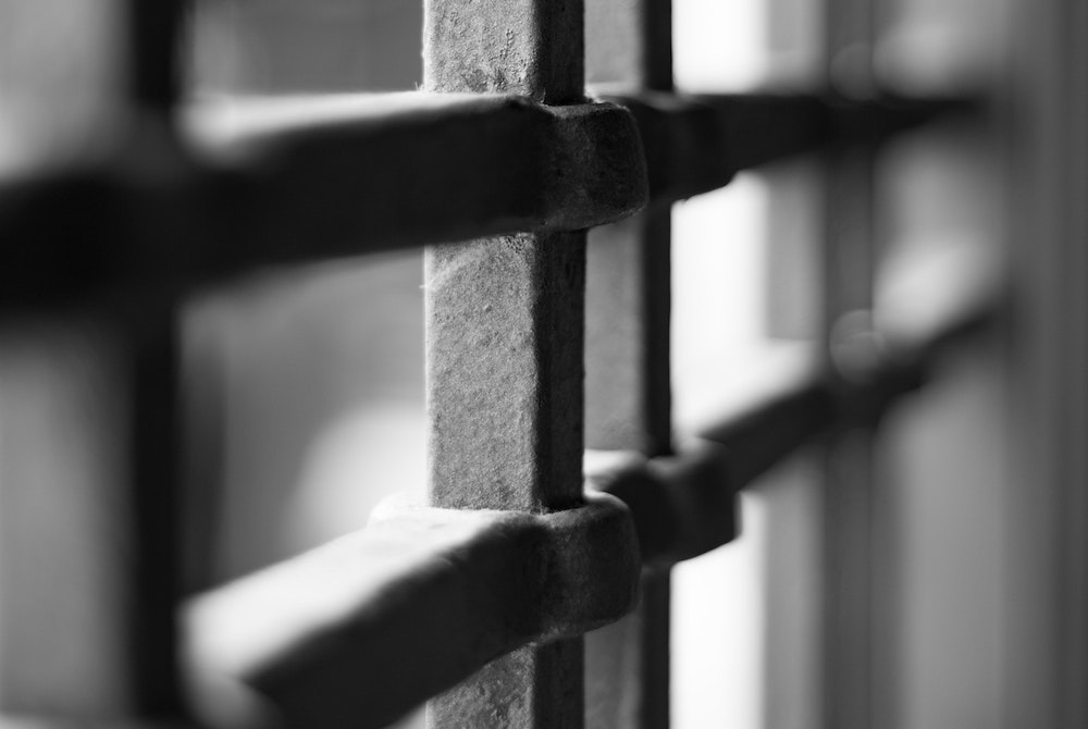 Prison bars illustration (Unsplash/Marco Chilese) Prison bars illustration (Unsplash/Marco Chilese)