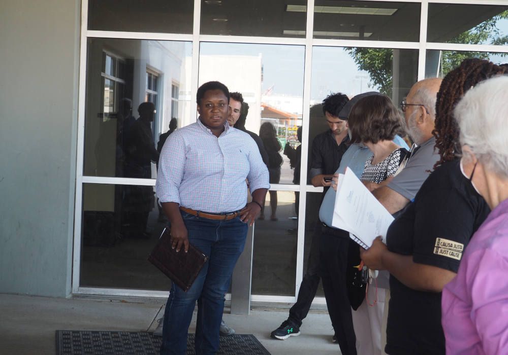 DeAndress Green, left, debriefs with leaders of Metro Congregations United after a meeting of the Missouri Air Conservation Commission in St. Louis. (RNS Photo/Britny Cordera)