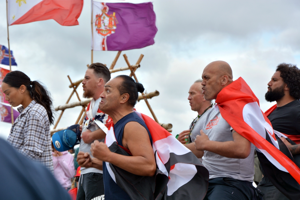 A group hailing from different Polynesian islands performs a haka for elders at the base of Mauna Kea. (RNS/Jack Jenkins)