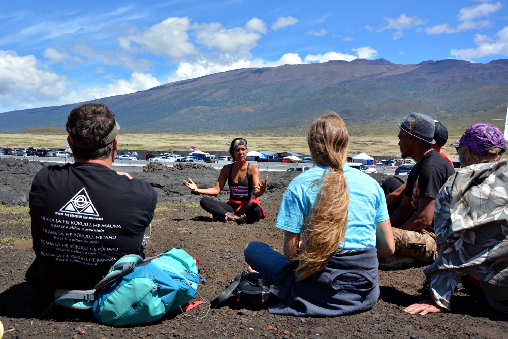 Mehana Makainai teaches a workshop on "land-based religion" in the protest camp at the base of Mauna Kea, Hawaii. (RNS/Jack Jenkins)