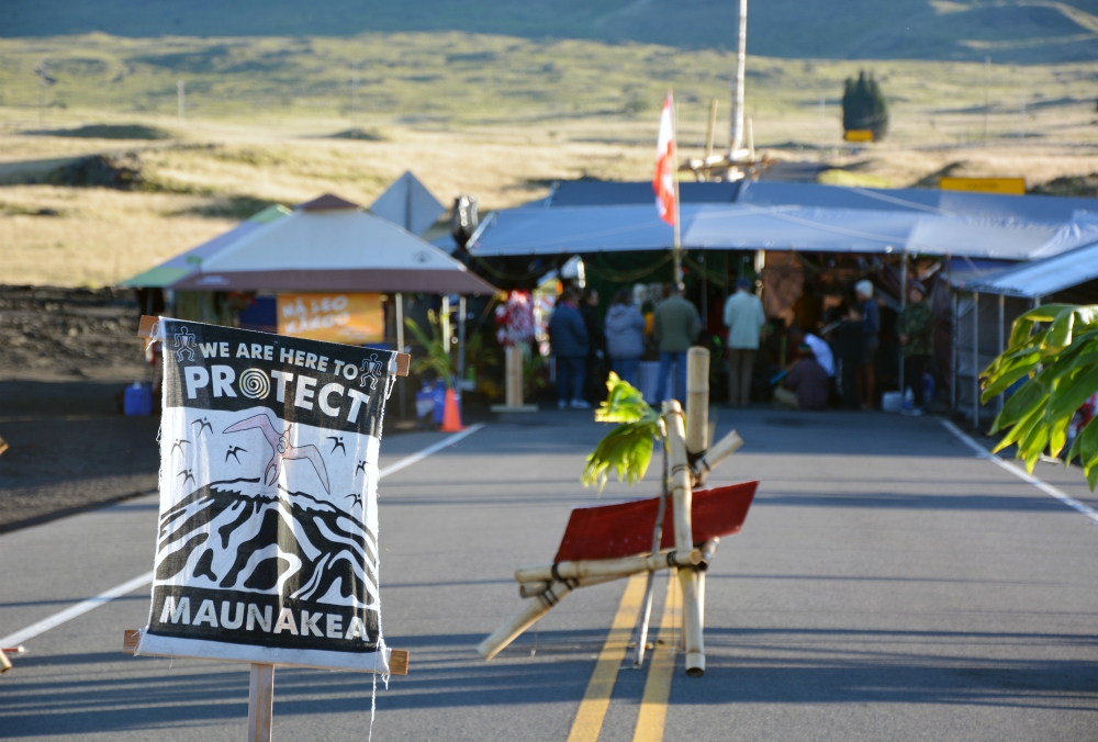 Early risers gather at the elder — or "kupuna" — tent positioned along the access road that leads to the top of Mauna Kea in Hawaii. (RNS/Jack Jenkins)