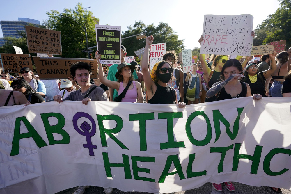 Demonstrators march and gather near the Texas state Capitol in Austin after the Supreme Court’s decision to overturn Roe v. Wade on June 24, 2022.