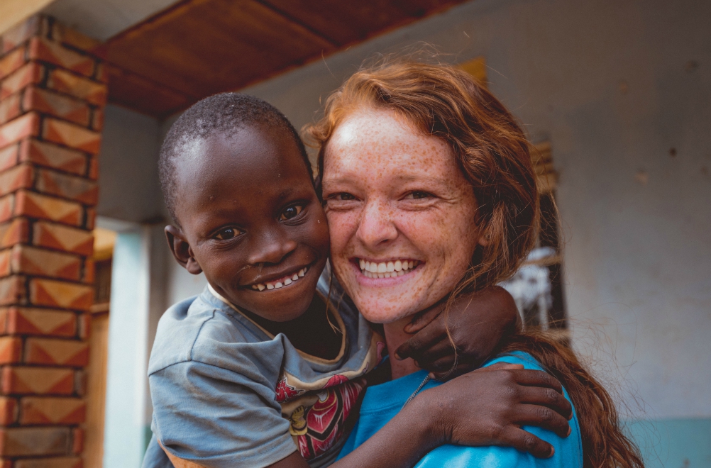 Rannah Evetts, founder of the St. Francis de Sales School for the Deaf in Uganda, enjoys a moment with one of her students. (Courtesy of St. Francis School for the Deaf)