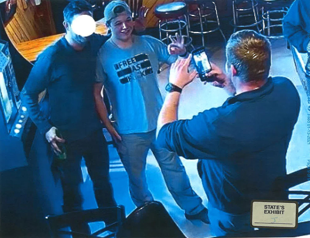 Kyle Rittenhouse was photographed wearing a "Free As F--k" shirt, and meeting members of the Proud Boys group at a bar in January 2021. (RNS/Kenosha County District Attorney)
