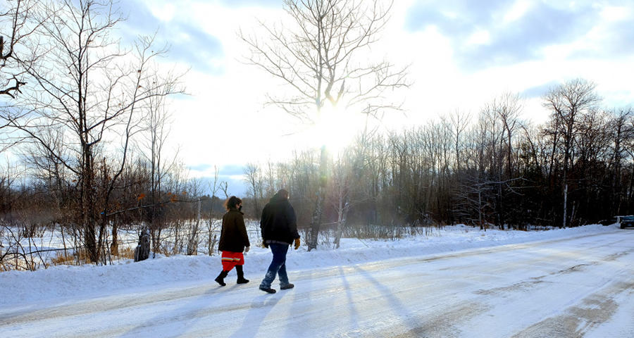 Taysha Martineau and Jason Goward walk down road between Camp Migizi and one of the Enbridge Line 3 work sites on the Fond du lac reservation. (Photo by Mary Annette Pember, Indian Country Today) Taysha Martineau and Jason Goward walk down road between Camp Migizi and one of the Enbridge Line 3 work sites on the Fond du lac reservation. (Photo by Mary Annette Pember, Indian Country Today)