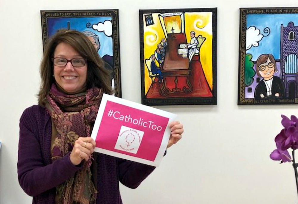 Deborah Rose-Milavec holds a sign for the Feminism and Faith in Union event. (Courtesy of FutureChurch) Deborah Rose-Milavec holds a sign for the Feminism and Faith in Union event. (Courtesy of FutureChurch)