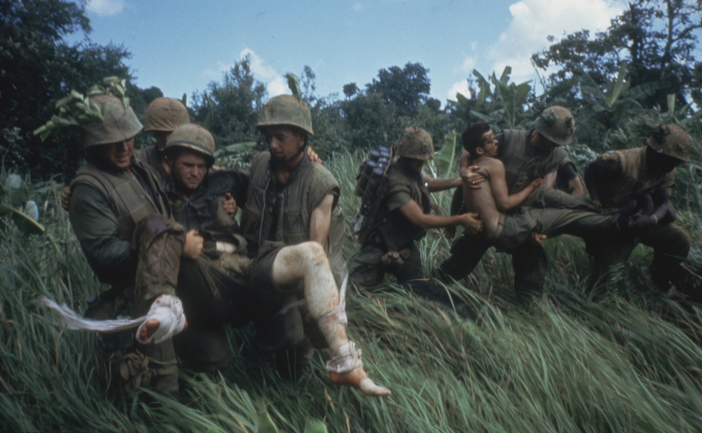 Marines carrying their wounded during firefight near the DMZ, 1966. (PBS/Courtesy of Getty Images/Larry Burrows) Marines carrying their wounded during firefight near the DMZ, 1966. (PBS/Courtesy of Getty Images/Larry Burrows)