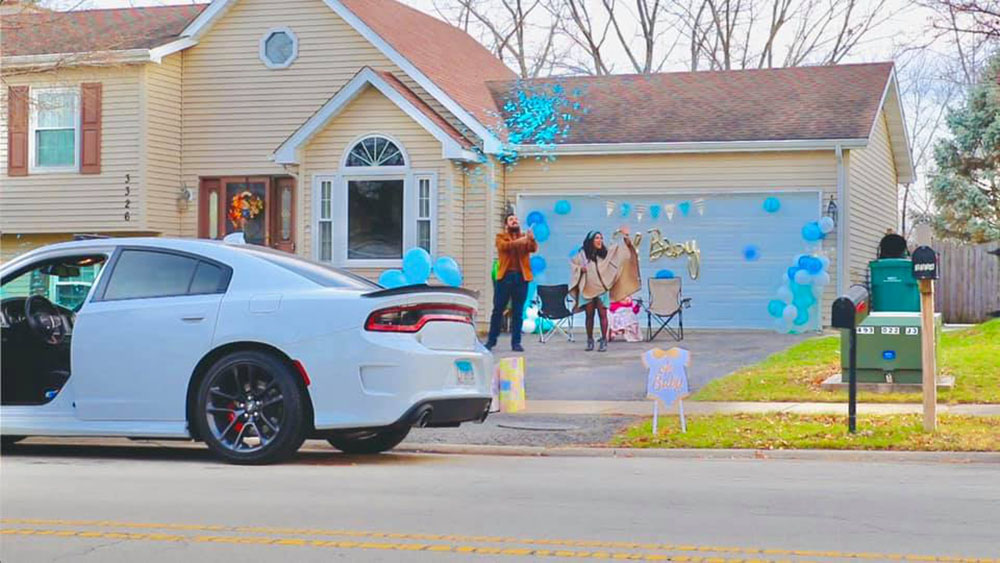 Sarai Martinez and husband at drive-through baby shower at their home in Joliet, Illinois, in October 2020 (Courtesy of Sarai Martinez)