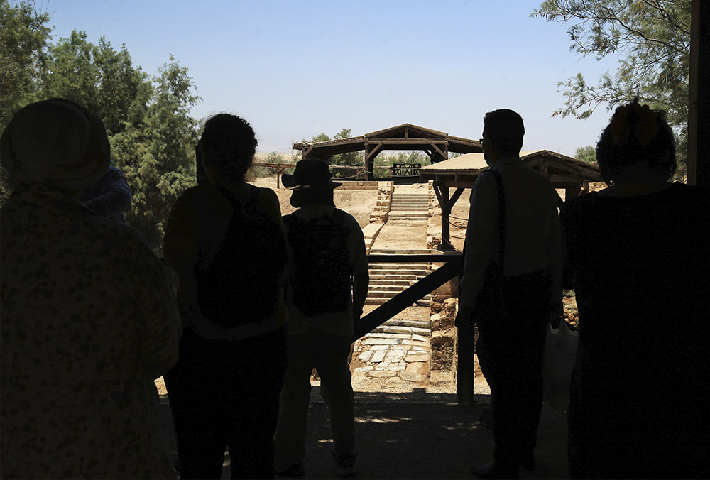 Tourists visit Al-Maghtas, known as Bethany Beyond the Jordan, on the east bank of the Jordan River in Jordan on June 8. UNESCO has declared Bethany Beyond the Jordan a World Heritage Site. (AP/Raad Adayleh)