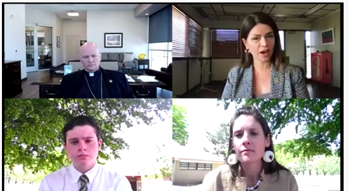 Mayor Regina Romero of Tucson, Arizona, at upper right, responds to a question from Salpointe Catholic High School sophomore Felipe Garcia, at lower left, as Tucson Bishop Edward Weisenburger and Ellen Fisher, Salpointe Laudato S' Committee co-chair, list