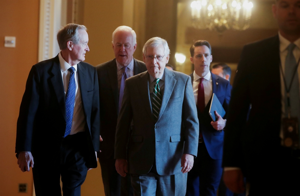 Senate Majority Leader Mitch McConnell, R-Kentucky, center, is seen with fellow Republican senators Jan. 16 at the U.S. Capitol in Washington. (CNS/Reuters/Jonathan Ernst)
