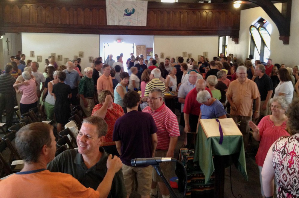 Parishioners of St. William Catholic Community in Louisville, Kentucky, share the sign of peace at Mass. (Courtesy of St. William Catholic Community)