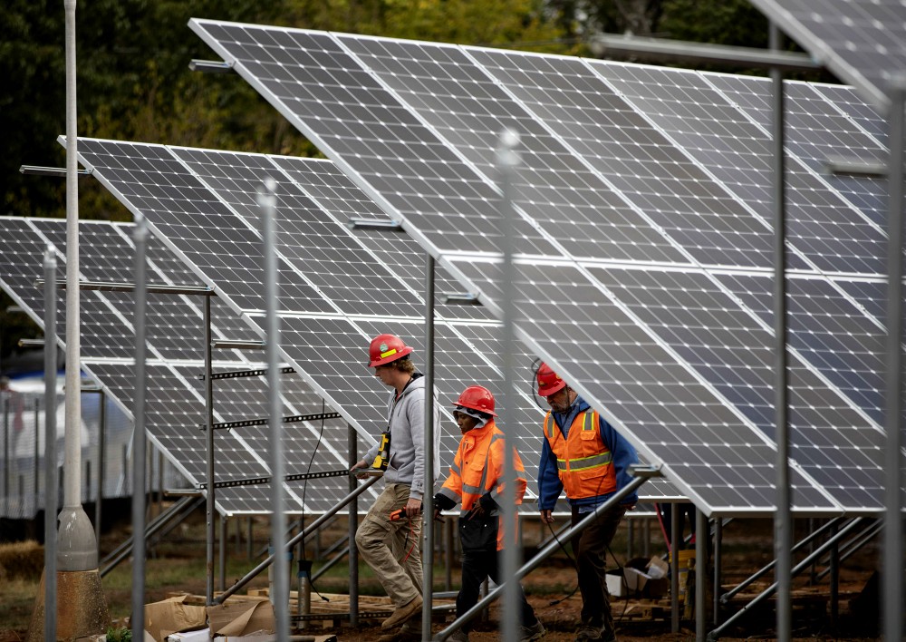 Workers in Washington are seen near solar panels Oct. 17, 2019, on the property of Catholic Charities of the Washington Archdiocese. (CNS/Catholic Standard/Andrew Biraj) Workers in Washington are seen near solar panels Oct. 17, 2019, on the property of Catholic Charities of the Washington Archdiocese. (CNS/Catholic Standard/Andrew Biraj)