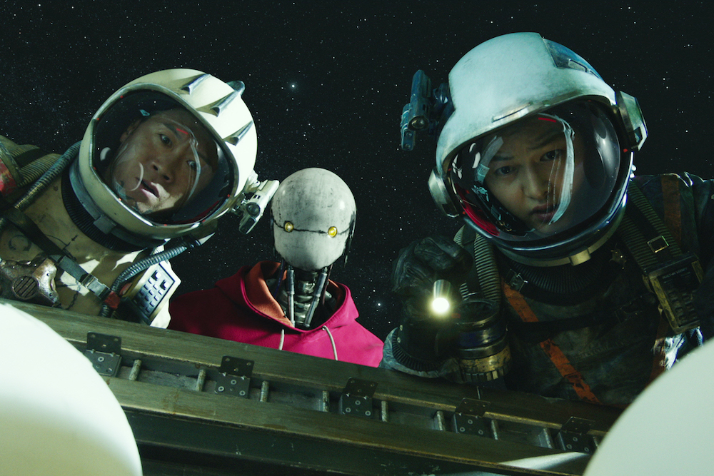 Jin Seon-kyu, Yoo Hai-jin and Song Joong-ki in a scene from "Space Sweepers" by director Jo Sung-hee (Netflix)