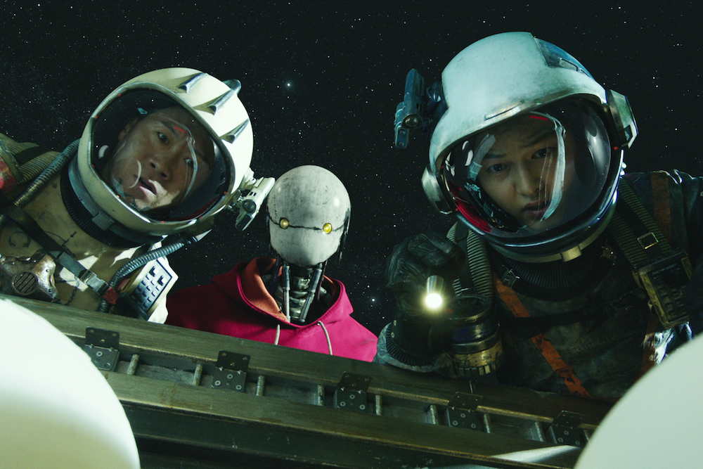 Jin Seon-kyu, Yoo Hai-jin and Song Joong-ki in a scene from "Space Sweepers" by director Jo Sung-hee (Netflix) Jin Seon-kyu, Yoo Hai-jin and Song Joong-ki in a scene from "Space Sweepers" by director Jo Sung-hee (Netflix)