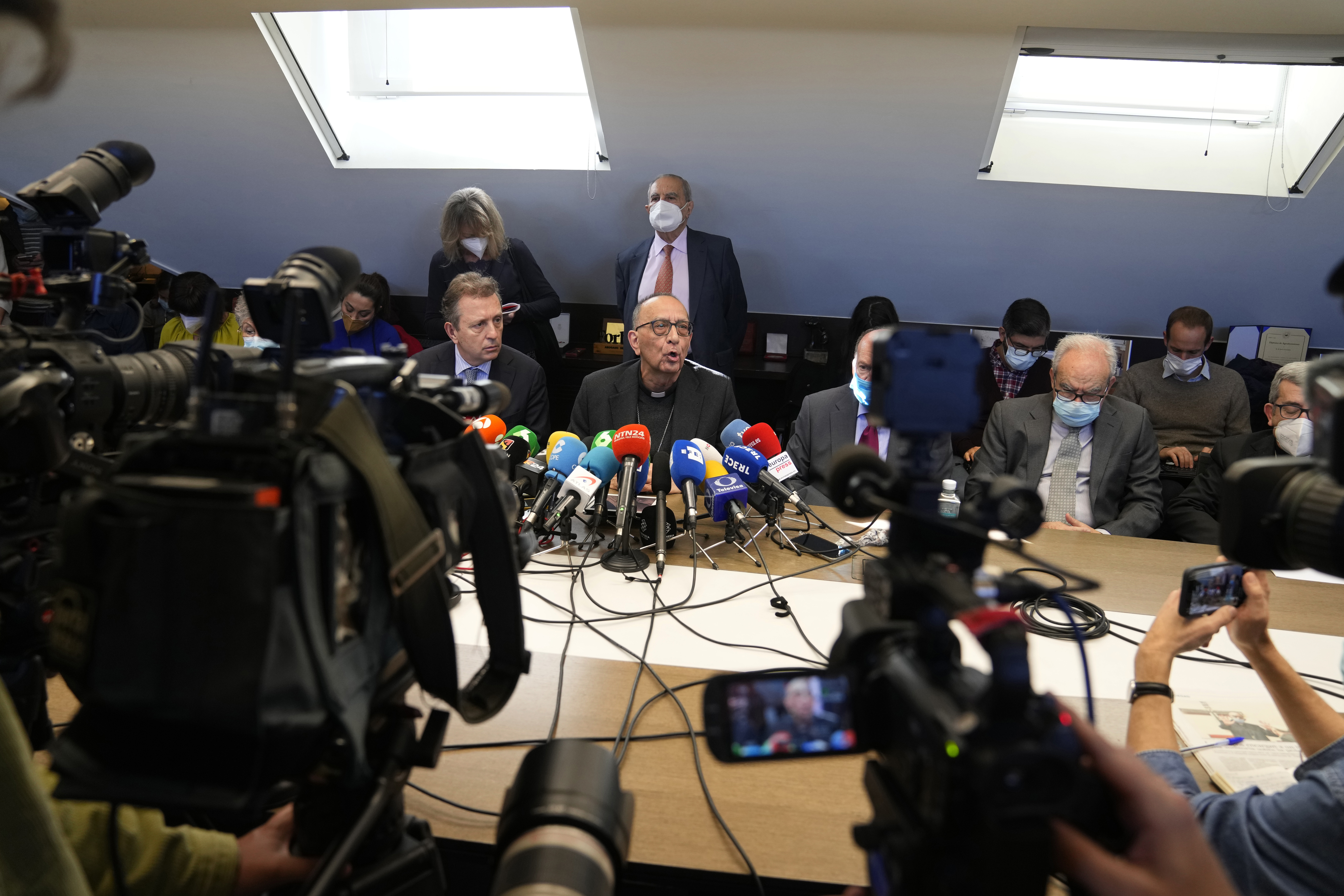 Cardenal Juan Jose Omella, center, speaks during a press conference in Madrid, Spain, Tuesday, Feb. 22, 2022. (AP Photo/Paul White)