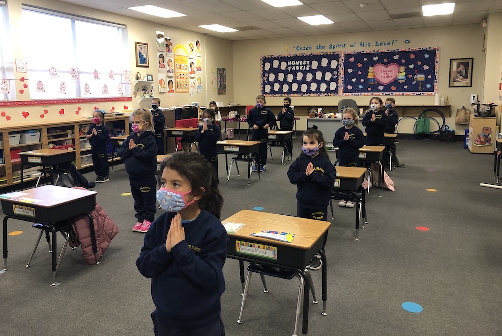 Distanced and masked students pray at St. Francis de Sales School in Las Vegas. (Courtesy of the Las Vegas Diocese)