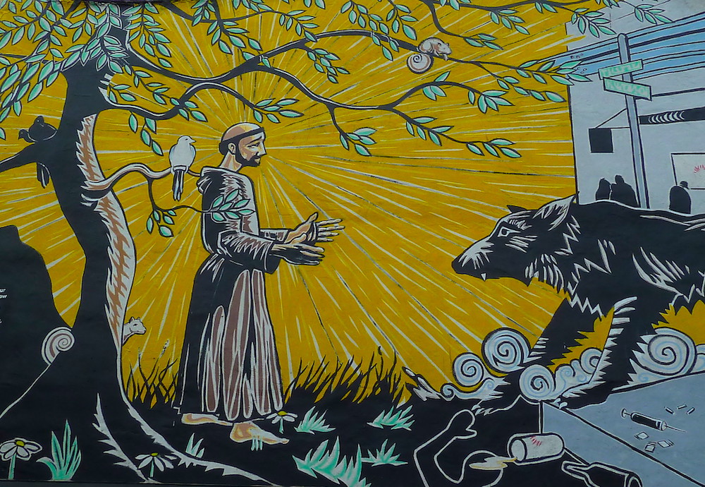 Detail of mural of St. Francis of Assisi and the wolf of Gubbio painted on the St. Francis Inn, Philadelphia, Pennsylvania, seen Oct. 1, 2010. (Flickr/Jim McIntosh)