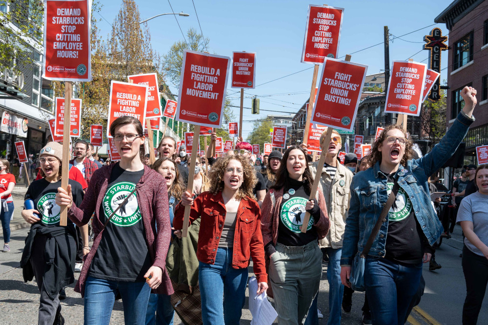 Starbucks workers march for the right to organize a workers' union on April 23 in Seattle. (Wikimedia Commons/elliotstoller)