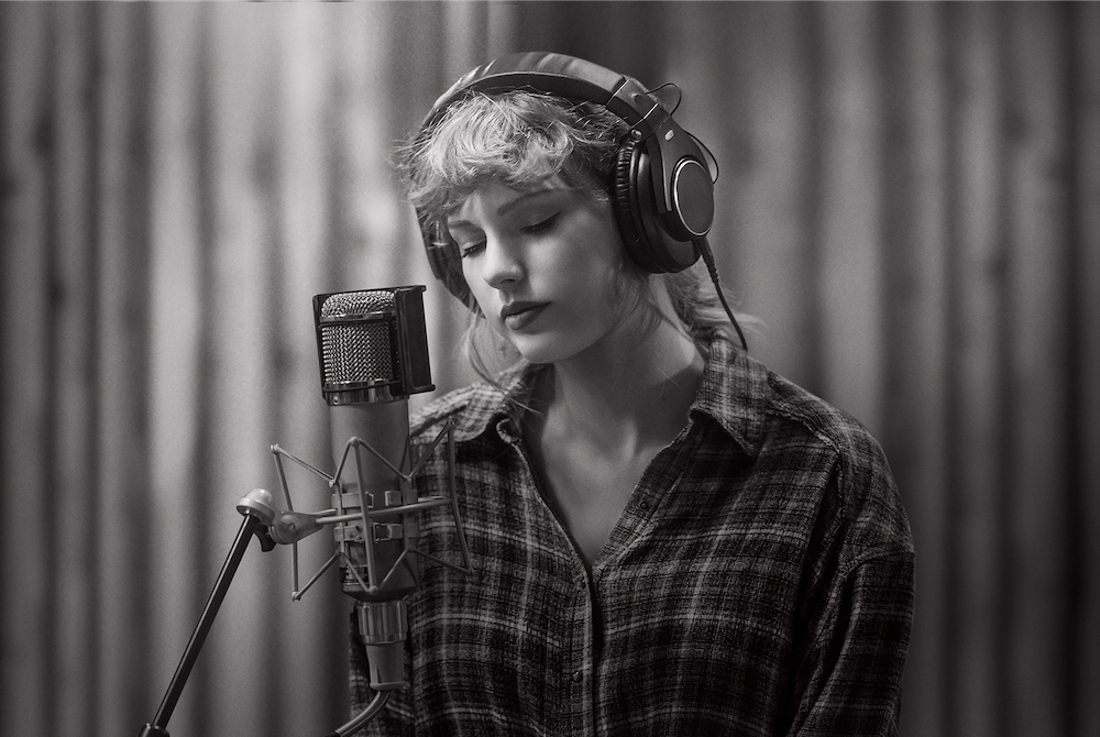 Taylor Swift in "folklore: the long pond studio sessions" on Disney+ (TAS Rights Management) Taylor Swift at a microphone in a studio